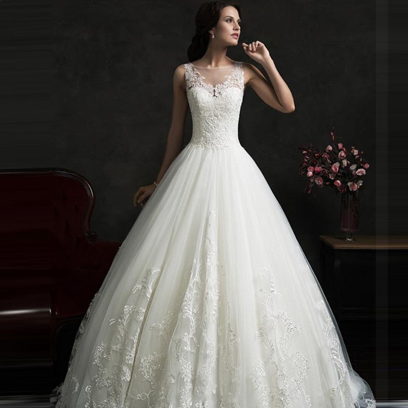 Fabulous Fall A-Line Wedding Gown With Sheer Boat Neck Illusion Buttons Back Lace Appliques And Chapel Train - A Thrifty Bride Shop