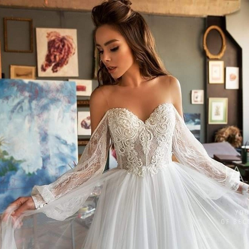 Elegant Bohemian Lace Beach Wedding Dress With Long Sleeves Off The Shoulder And Flowing Skirt