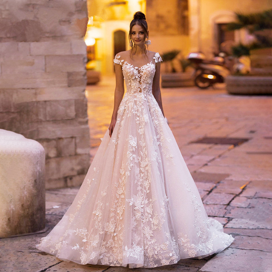 Stunning Backless Wedding Dress With A-line Bodice Cap Sleeves And 3D Appliques Features Tulle And Lace Beading On Plush Skirt