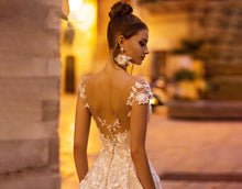 Load image into Gallery viewer, Stunning Backless Wedding Dress With A-line Bodice Cap Sleeves And 3D Appliques Features Tulle And Lace Beading On Plush Skirt