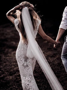 Wedding Dress Features Deep V-Neck Sexy Backless With Cap Sleeves Made In Lace Sheath Boho Style